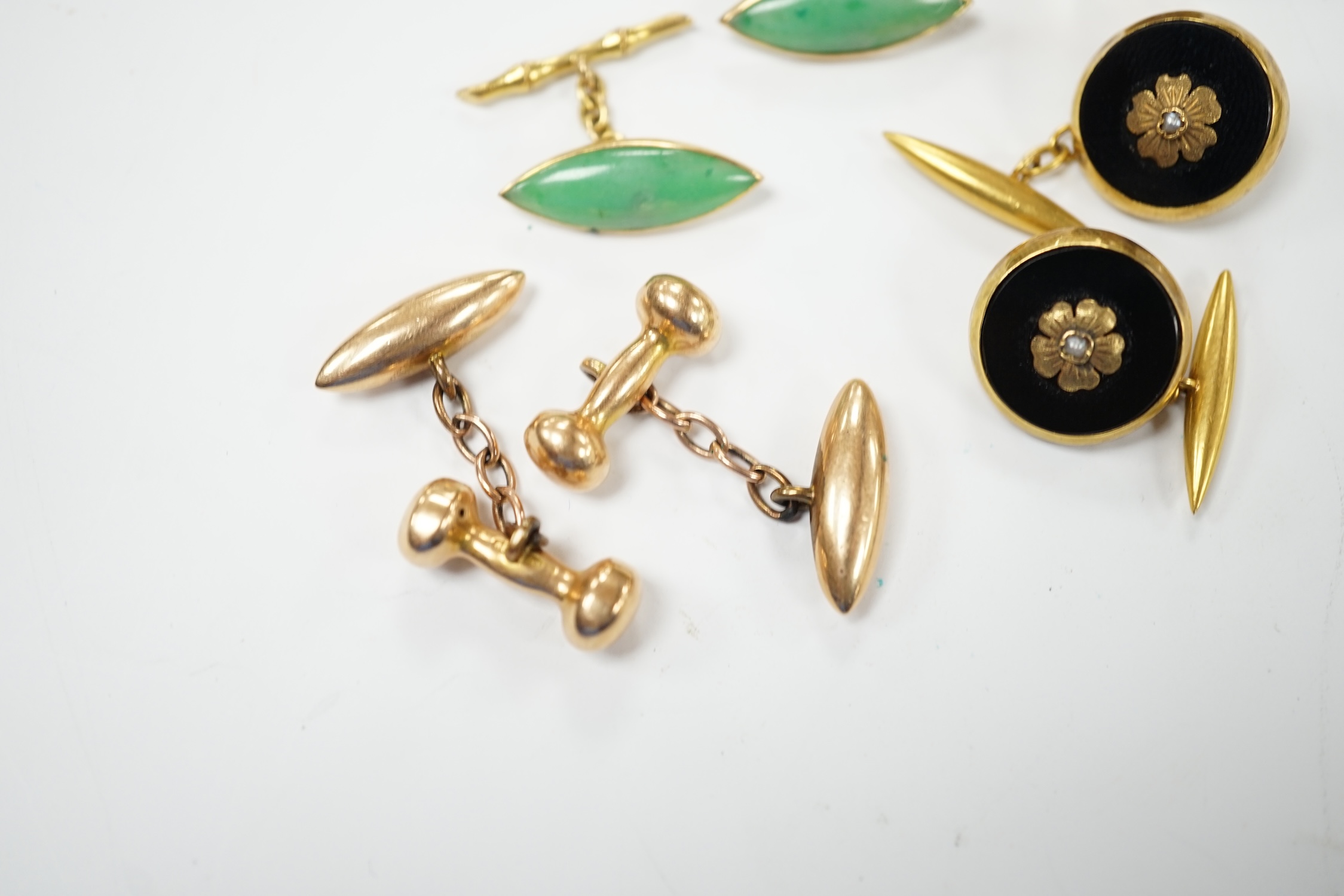 A pair of Edwardian 15ct gold torpedo shaped cufflinks, 9,6 grams and three other pairs of cufflinks including Chinese jade and monogrammed 9ct gold. Fair to good condition.